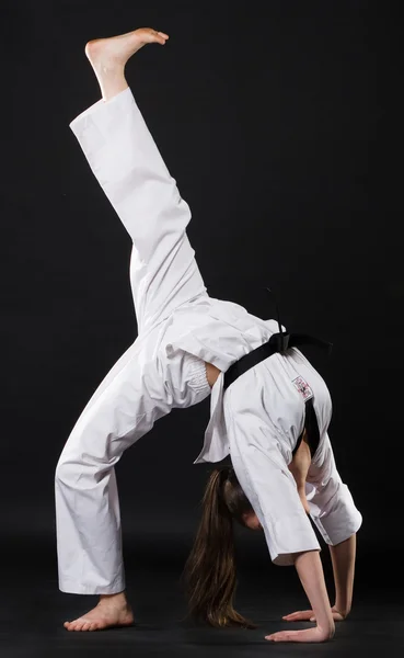 stock image Girl in kimono exercising karate kata