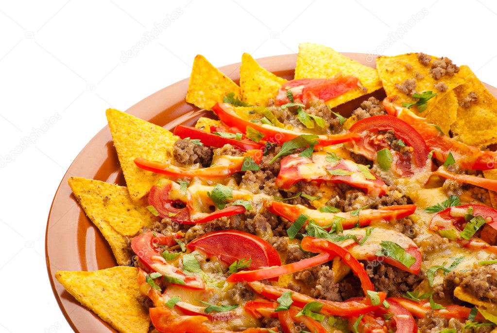 Spicy nachos with pork, tomato and pepper