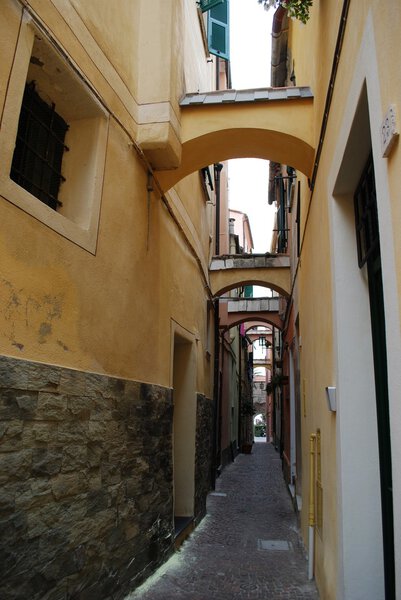 Small street and colorful houses, Noli village, Liguria, Italy