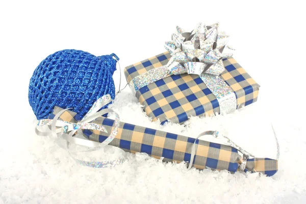Christmas gift boxes on snow — Stok fotoğraf