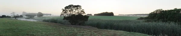 Sisli gündoğumu panorama Stok Resim