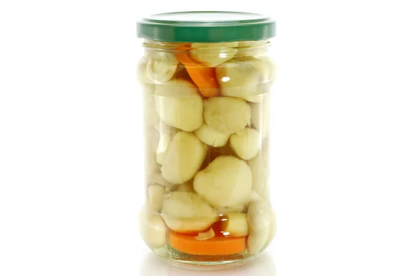 Glass jar of preserved mushrooms — Stock Photo, Image