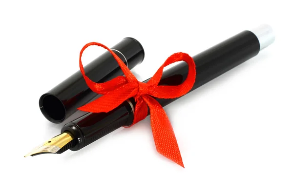 Перьевая ручка с красным луком — стоковое фото