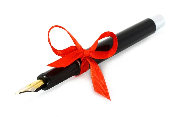 Fountain pen with red bow — Stock Photo, Image