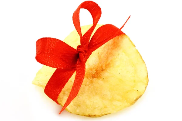Single potato chip with red bow — Stock Photo, Image
