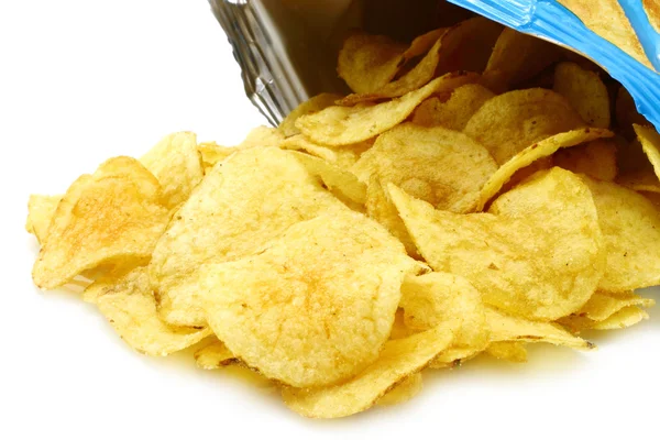 Potato chips poured out from packing — Stock Photo, Image