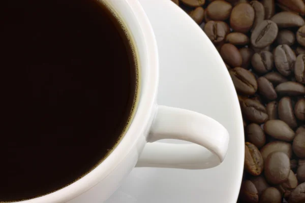 Tasse de café avec grains de café — Photo