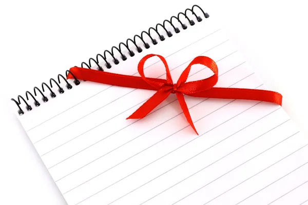 Notepad with red bow — Stock Photo, Image