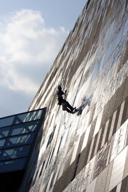 Worker washing windows clipart