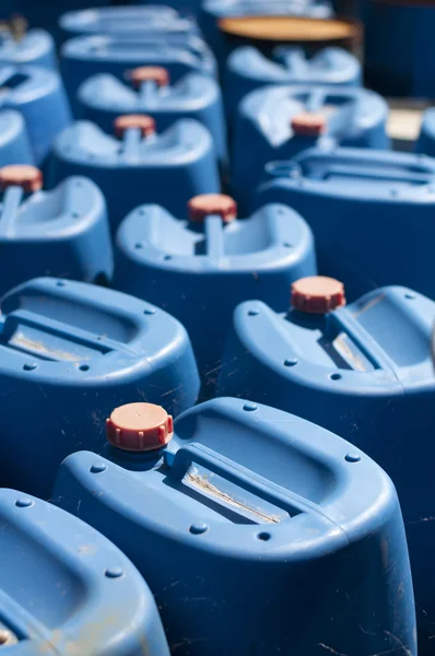 Old blue canisters for oil products — Stock Photo, Image