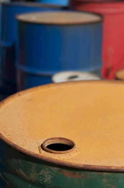 Old colored barrels for oil products — Stock Photo, Image