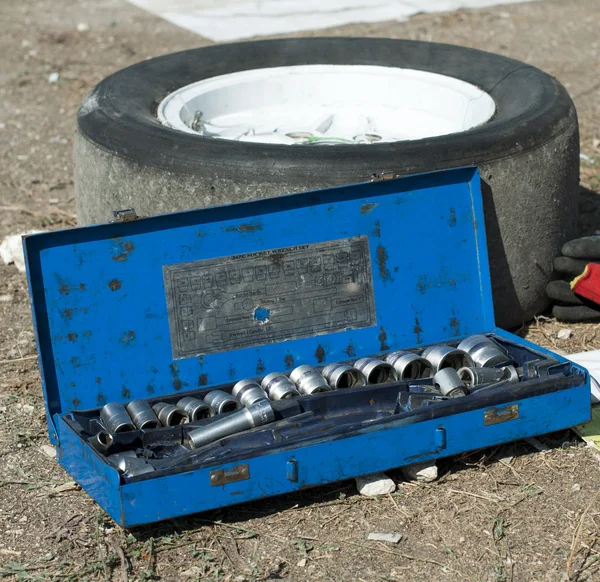 Car mechanic tools and tire — Stock Photo, Image