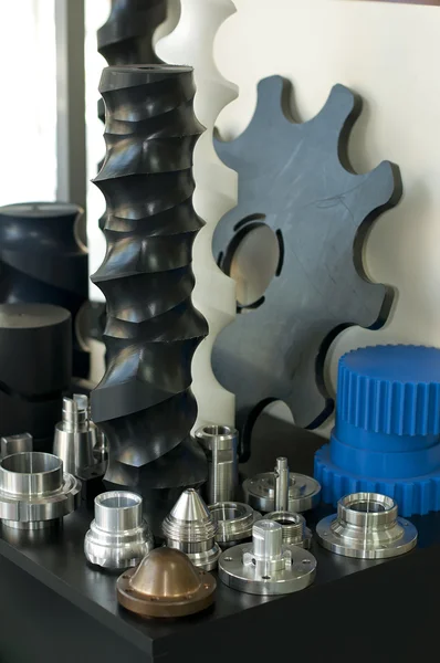 Plastic and metal machine parts. Vertical imagel — Stock Photo, Image