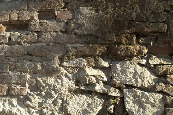 Oude bakstenen en stenen muur — Stockfoto
