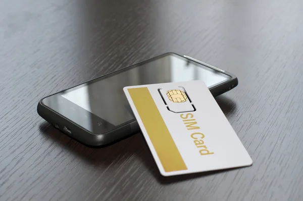 SIM-kaart en mobiele telefoon — Stockfoto