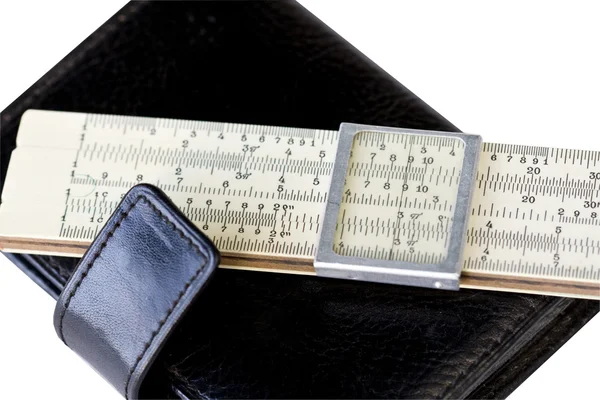 Scale ruler on black moleskin — Stock Photo, Image