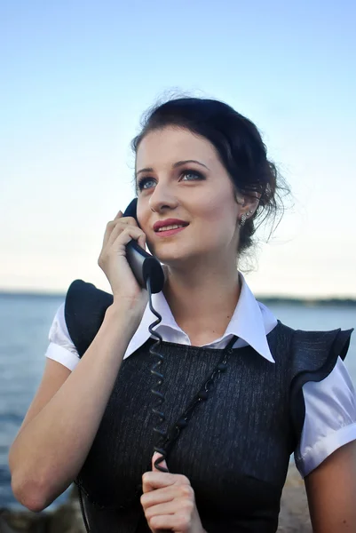 Chica con un receptor de teléfono en la mano —  Fotos de Stock