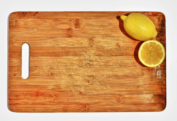 Two lemons on the kitchen board, concept, space for text — Stock Photo, Image