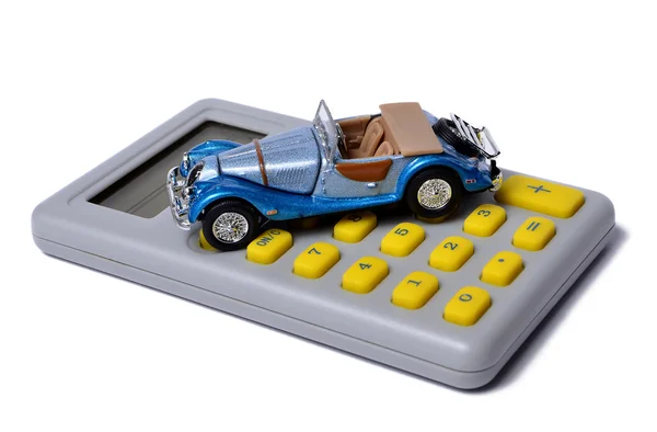 Miniatűr kisbuszt egy számológépet elszigetelt fehér, koncepció — Stock Fotó