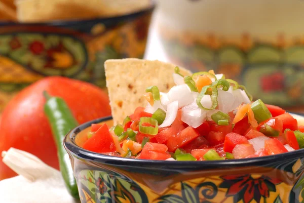 Spicy salsa with tortilla chips — Stock Photo, Image