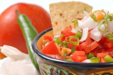 Spicy salsa with variety of ingredients clipart