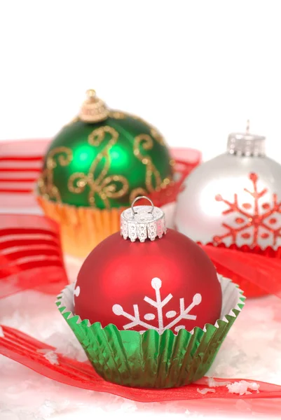 Christmas ornaments in cupcake liners — Stock Photo, Image