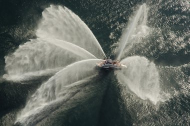 Fire Boat Spraying Water at Watershow clipart