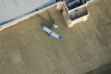 Single Plane Outside of Executive Hangar clipart