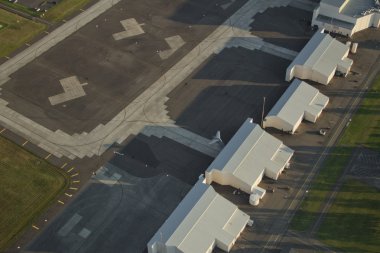 C-17 Tail Sticking Out of Hangar at Air Force Base clipart