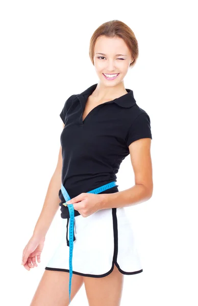 Young woman measuring the shape. The concept of a healthy lifest — Stock Photo, Image