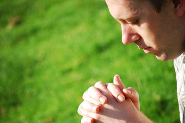 Young man praying clipart