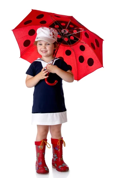 Das kleine Mädchen mit Regenschirm und Gummistiefeln — Stockfoto