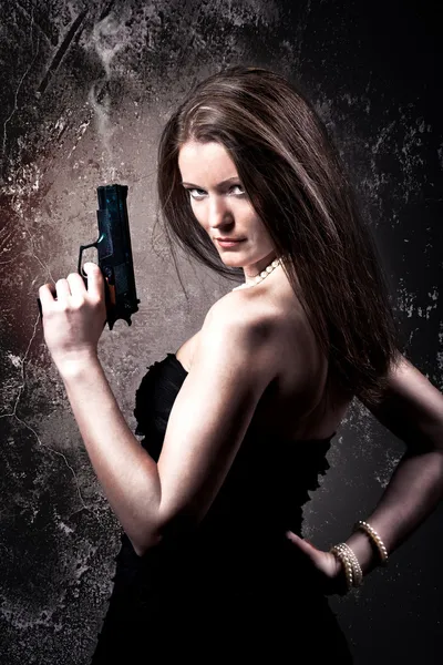 Kvinna med pistol Stockbild