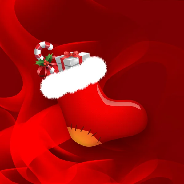 Weihnachtssocke auf rotem Hintergrund — Stockfoto