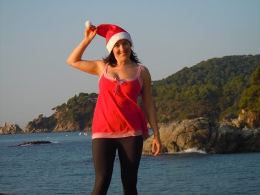 Playful santa´s helper by the sea