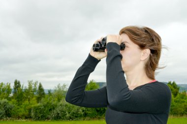 Woman with binoculars clipart