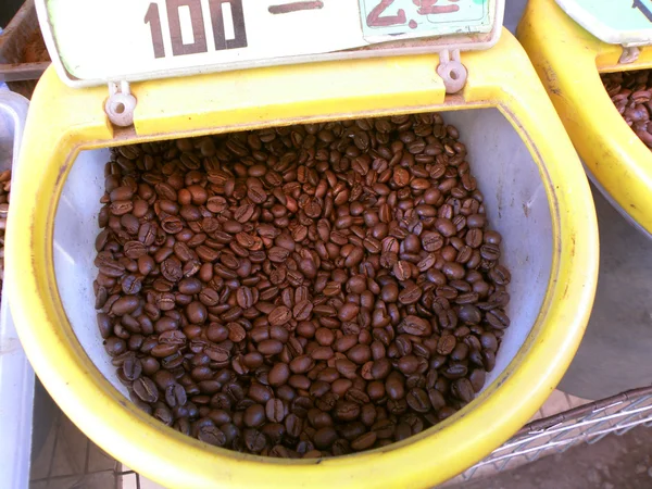 Coffee beans selling from a plastic bucket — Stock Photo, Image