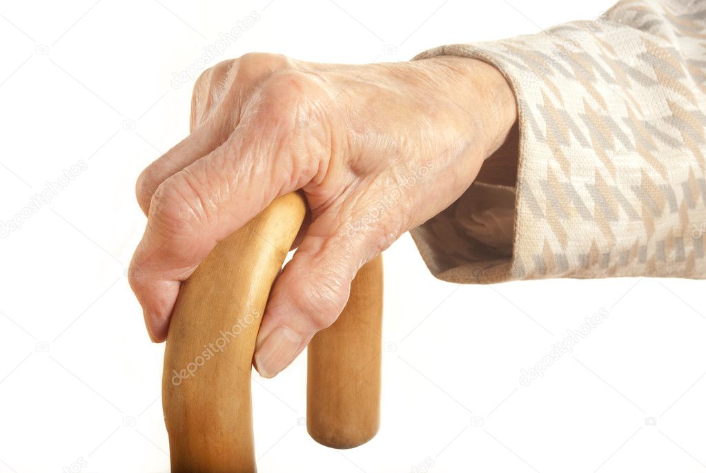 Old Ladies hand with walking stick