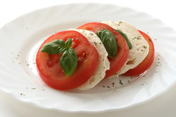 Cheese mozarella with tomato and basil — Stock Photo, Image