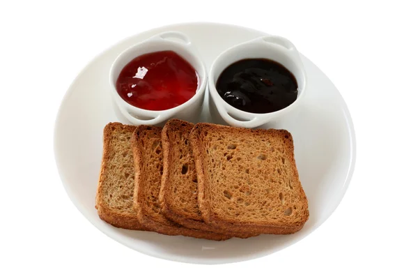 Toasts with jam in small bowls — Stock Photo, Image