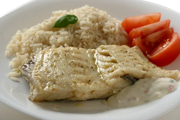 Codfish with rice and sauce — Stock Photo, Image