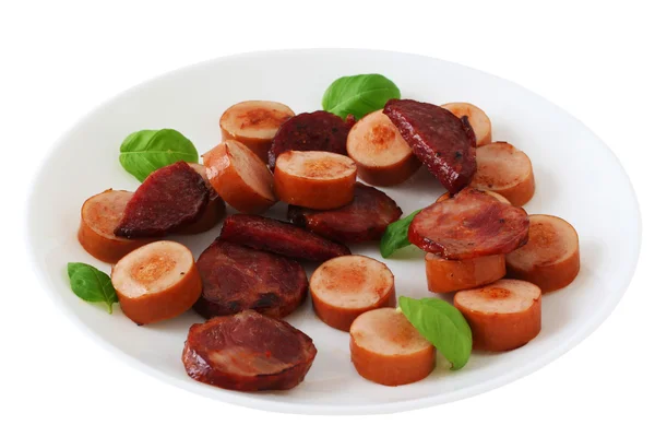 Cut fried sausages on a plate — Stock Photo, Image