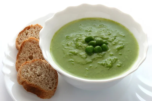 Pea soup with bread — Stock Photo, Image