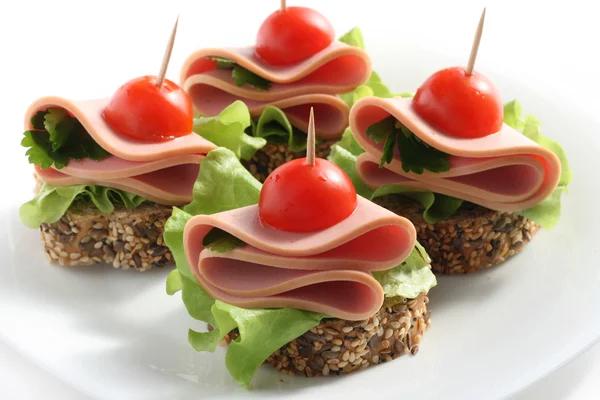 Canape with boiled sausage — Stock Photo, Image