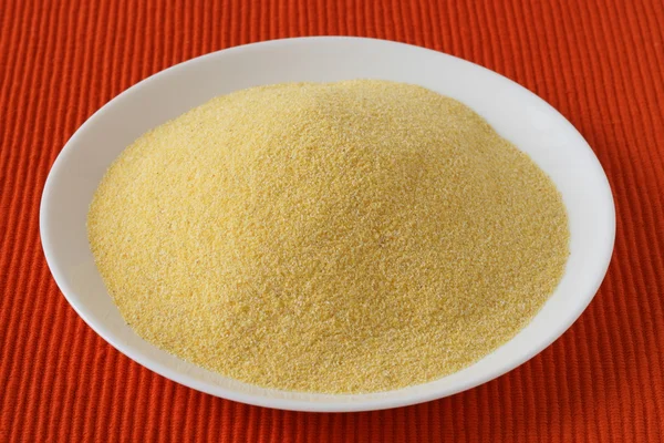 Cornmeal on white plate — Stock Photo, Image