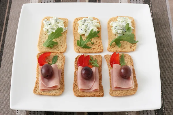Toasts with ham and dip — Stock Photo, Image