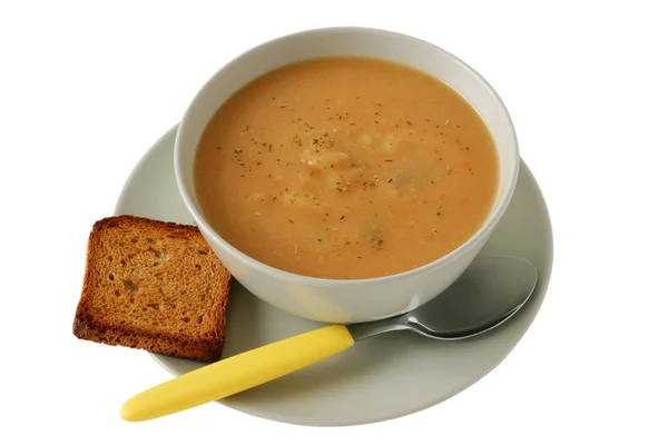 Суп в миске с тостами — стоковое фото