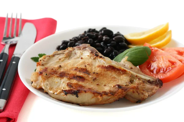 Grilled pork with beans, tomato and lemon — Stock Photo, Image