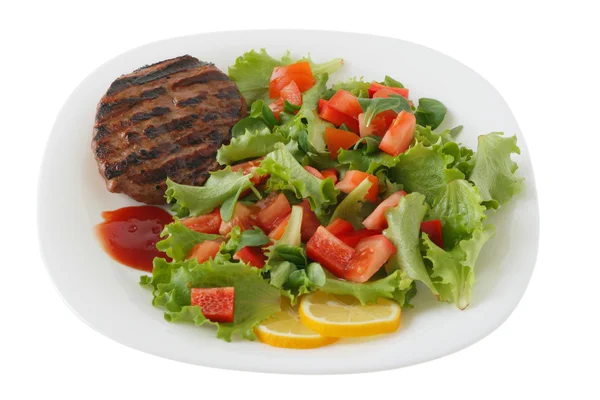 Turkey hamburger with salad, lemon and sauce — Stock Photo, Image