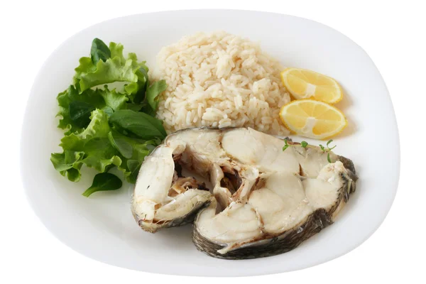 Boiled fish with rice and lemon — Stock Photo, Image